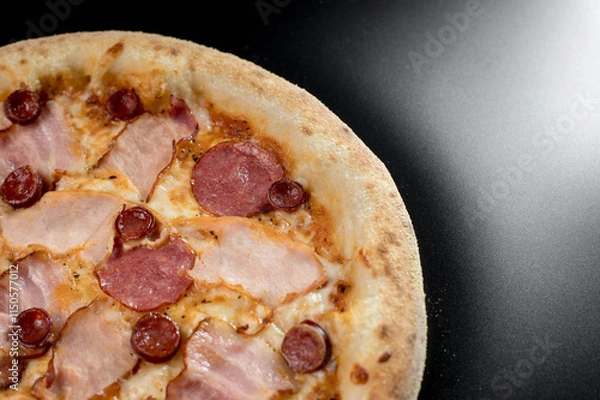 Fototapeta details of the pizza application; juicy pizza from the oven with mushrooms, tomatoes and bacon and sprinkled with parmesan cheese