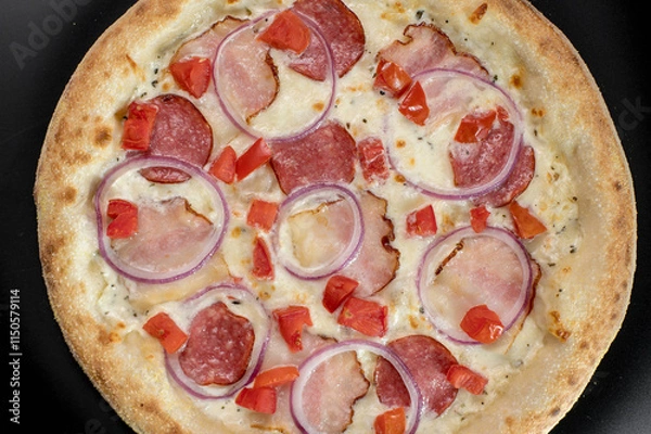Fototapeta details of the pizza application; juicy pizza from the oven with mushrooms, tomatoes and bacon and sprinkled with parmesan cheese