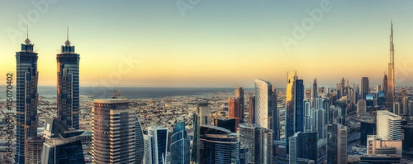Fototapeta Malowniczy widok na nowoczesną architekturę Dubaju o zachodzie słońca. Aerial skyline z wieżowcami w centrum miasta.