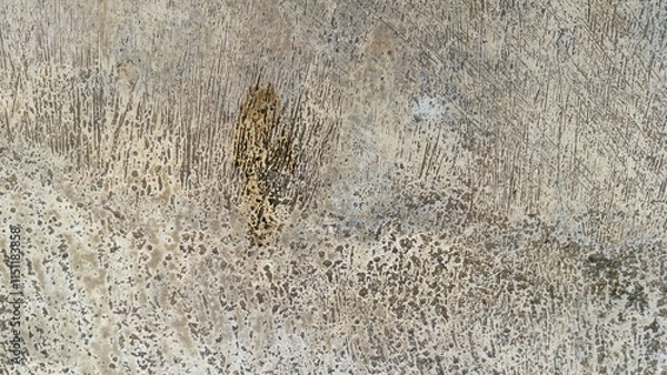 Fototapeta Abstract Textured Cement Floor Surface with Scratched and Stained Pattern in Neutral Colors