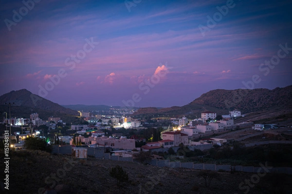 Fototapeta Landscape view of a city, View of Al hada City, Taif in Evening from the mountain top