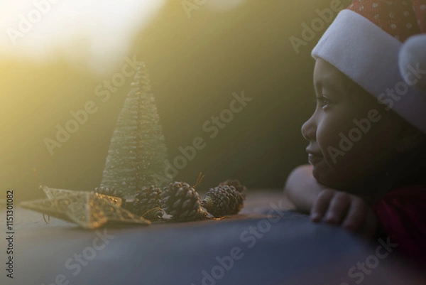 Obraz A little girl is happy to join the christmas day.