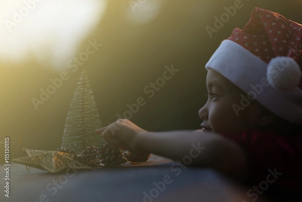 Obraz A little girl is happy to join the christmas day.