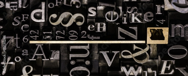 Fototapeta Historical letterpress types, also called as lead letters. These kind of letters were used in Gutenberg presses. These letters were the beginning of typography. And were used in typesetting