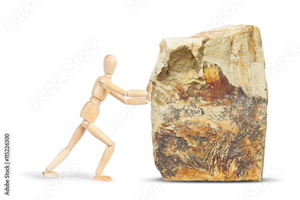 Obraz Man tries to move a huge rock. Abstract image with a wooden puppet