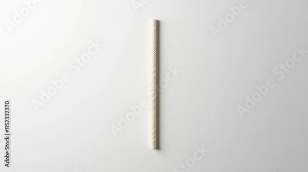 Fototapeta a single striped drinking straw on a white background