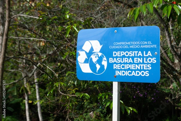 Fototapeta Signage to promote the proper disposal of garbage in the park, focused on the care and preservation of the environment.