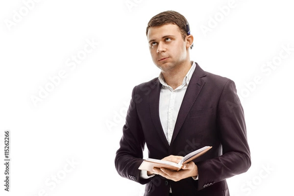 Obraz Handsome businessman with diary