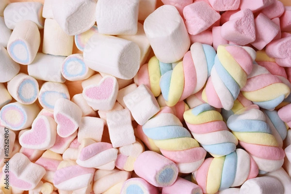 Fototapeta Confectionery and sweeties varieties background: light pink and white marshmallows, sugar confetti, bonbon and candies, selective focus, shallow focus