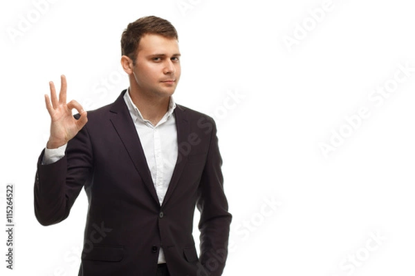 Obraz Handsome businessman shows okay gesture