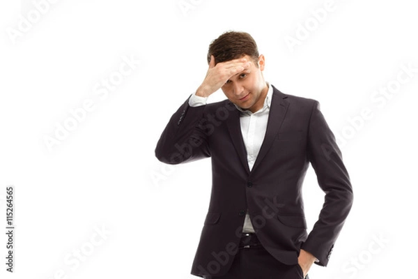 Obraz Handsome businessman put hand on forehead