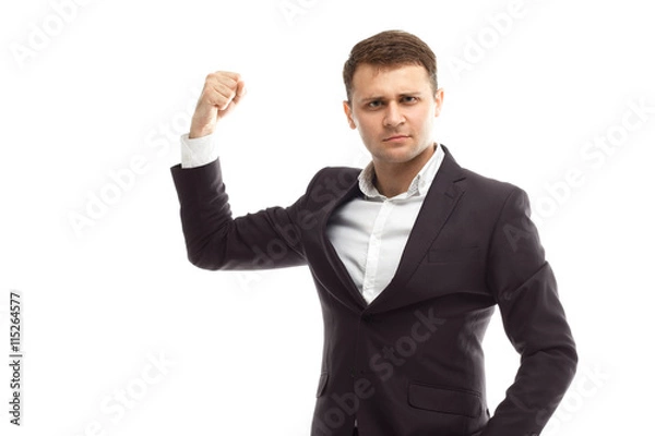 Obraz Handsome businessman shows biceps