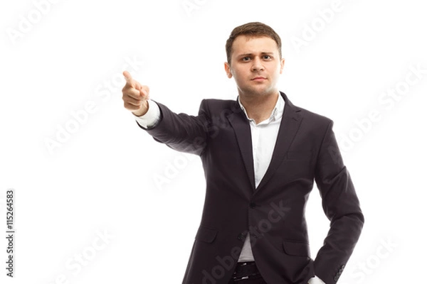 Fototapeta Handsome businessman shows finger forward