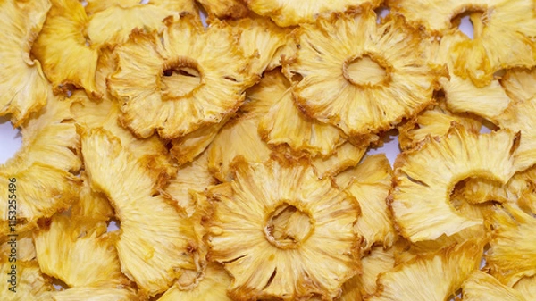 Obraz Crisps, handmade dried pineapple snacks, fruit background, selective focus