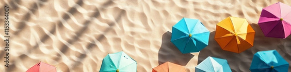Fototapeta Bird's-Eye View of Colorful Umbrellas on Sandy Beach
