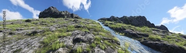 Fototapeta A scenic view of a rocky hillside with a flowing stream under a blue sky.