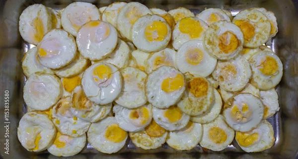 Fototapeta Top View of Stacked Fried Eggs