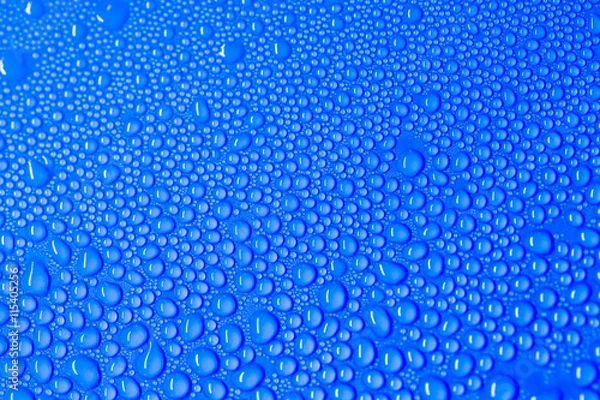 Obraz drop of water on blue background