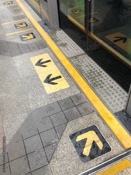 Fototapeta A view of arrows on platform in a long view. Taken on July 3, 2016 at BTS Chong Nonsi station in Bangkok Thailand.