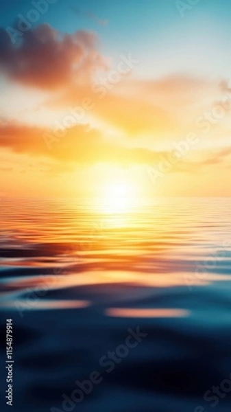 Fototapeta A serene sunset reflecting on calm waters, creating a beautiful blend of warm colors and soft ripples.