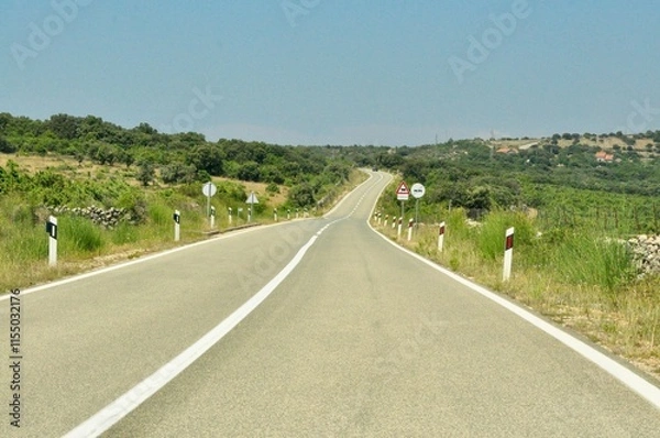 Fototapeta Prairie highway. Long stretch of flat highway in Rijeka, Croatia. Highway Rijeka Zagreb.Nobody On Highway In Springtime. Early in the morning, nobody on the road on a beautiful day.