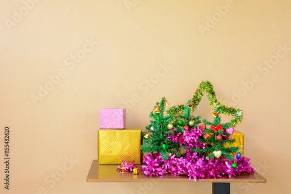 Obraz Small Christmas Tree with Decorative line and Gift Boxes on Table