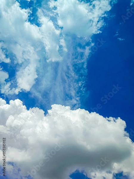 Fototapeta Clouds floating in blue sky.
