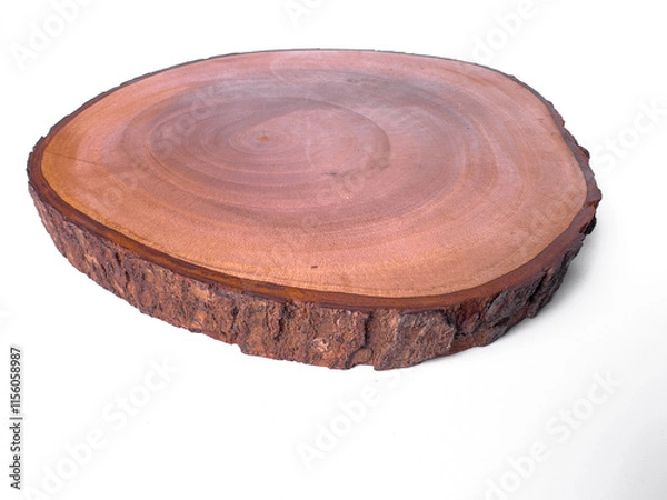 Fototapeta Flat wooden slice with dark bark edge and rich grain pattern on the surface. Perfect for rustic, eco-friendly, or crafting themes.