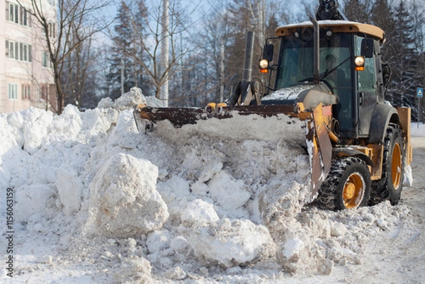 Obraz Snow removal in the city. Special equipment for removing snow from the road.