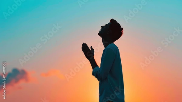 Obraz Silhouetted figures kneel in prayer against a stunning sunset, embodying deep repentance and glorifying God with praise.