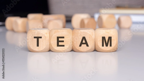 Fototapeta The concept of team collaboration depicted with wooden blocks represents unity and teamwork
