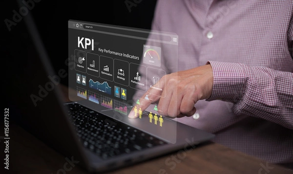 Fototapeta KPI key performance indicator. A businessman with a notebook computer uses KPIs to measure progress of his business, project, or work over time to reach the goals