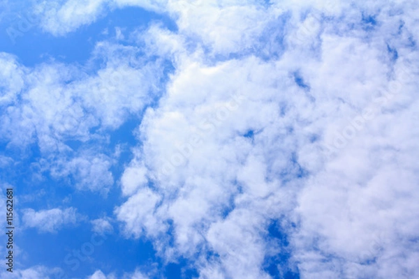Obraz Blue sky background with white clouds. The vast blue sky and clouds sky on sunny day. White fluffy clouds in the blue sky. beautiful clouds and blue sky.