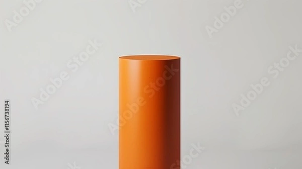Fototapeta A vibrant orange cylinder with a smooth surface, elevated against a stark white background