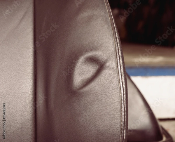 Obraz Dent on leather seat