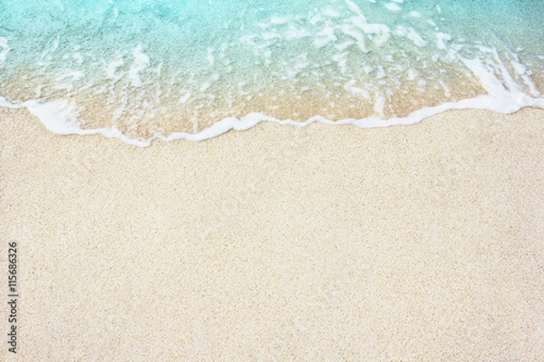 Obraz Miękka fala błękitnego oceanu na piaszczystej plaży, tło.