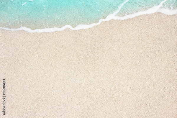 Fototapeta Soft ocean wave on the sandy beach, background.