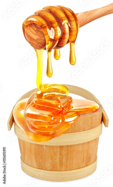 Fototapeta honey dripping in a bucket isolated 