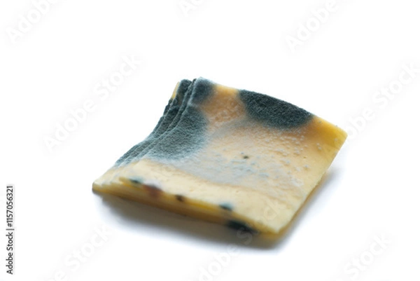 Obraz Slices of moldy ,rotten yellow cheese isolated on white background.