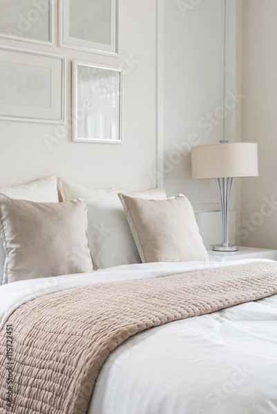 Fototapeta modern lamp on table side with picture frame on wall in bedroom