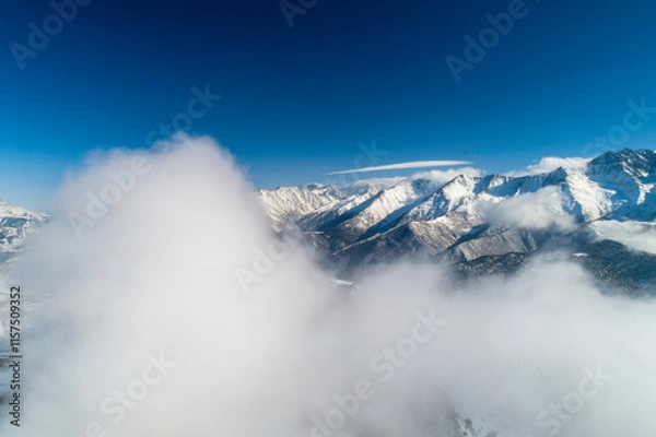 Fototapeta Mountains in the clouds. Low clouds in the North Caucasus mountains