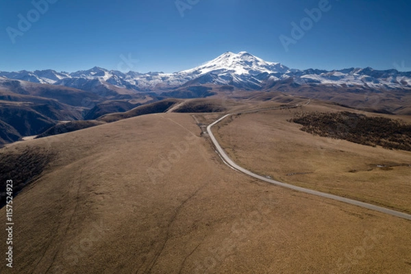 Fototapeta Beautiful view of the snowy peaks of Mount Elbrus. Landscape and nature of the North Caucasus