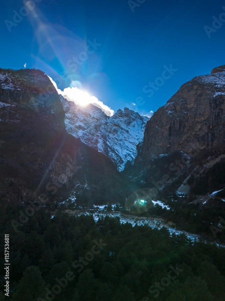 Fototapeta Beautiful aerial view of snowy peaks in a picturesque gorge. Landscape and nature of the North Caucasus