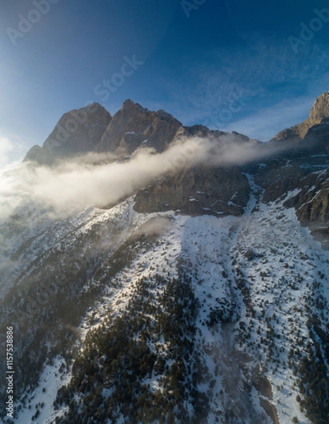 Fototapeta Mountains in the clouds, low clouds in a mountain valley. Landscape and nature of the North Caucasus