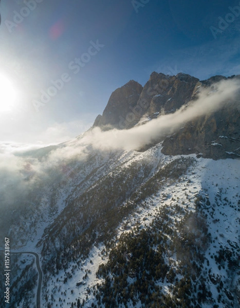 Fototapeta Mountains in the clouds, low clouds in a mountain valley. Landscape and nature of the North Caucasus