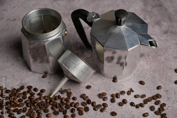 Obraz Disassembled geyser coffee maker moka machine parts. Scattered fresh aromatic coffee beans around. Gray concrete background. Preparation to making coffee