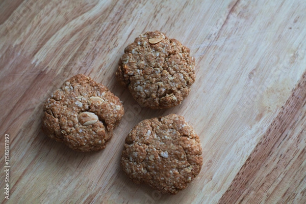 Obraz Healthy crispy oat cookies on a wooden background, Healthy food for diet lifestyle