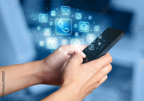 Fototapeta Hand holding smartphone with mobile app icons