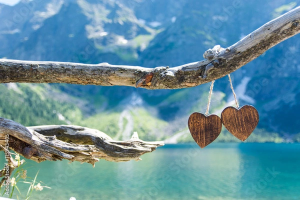 Fototapeta Two wooden heart on the background of the Mountain Lake Morskie Oko in the High Tatras 