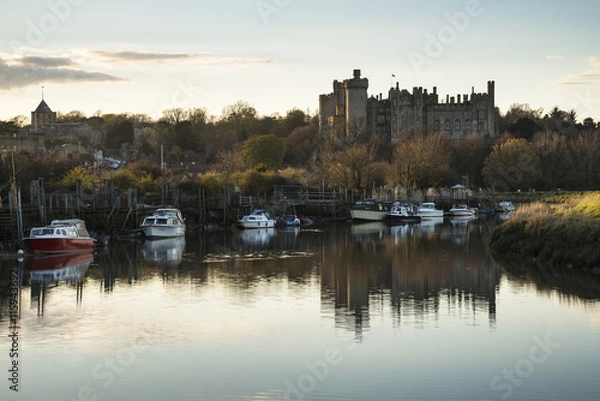 Fototapeta Landscape image of old medieval Castle viewed across River at su